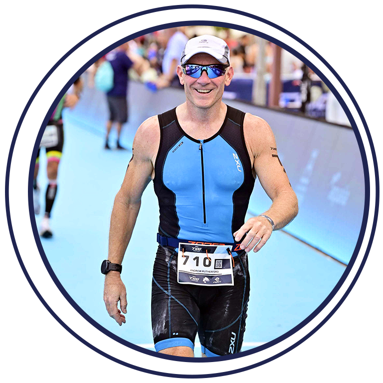 Andy Rutherford completing a triathlon event, representing resilience, goal setting and personal growth through coaching